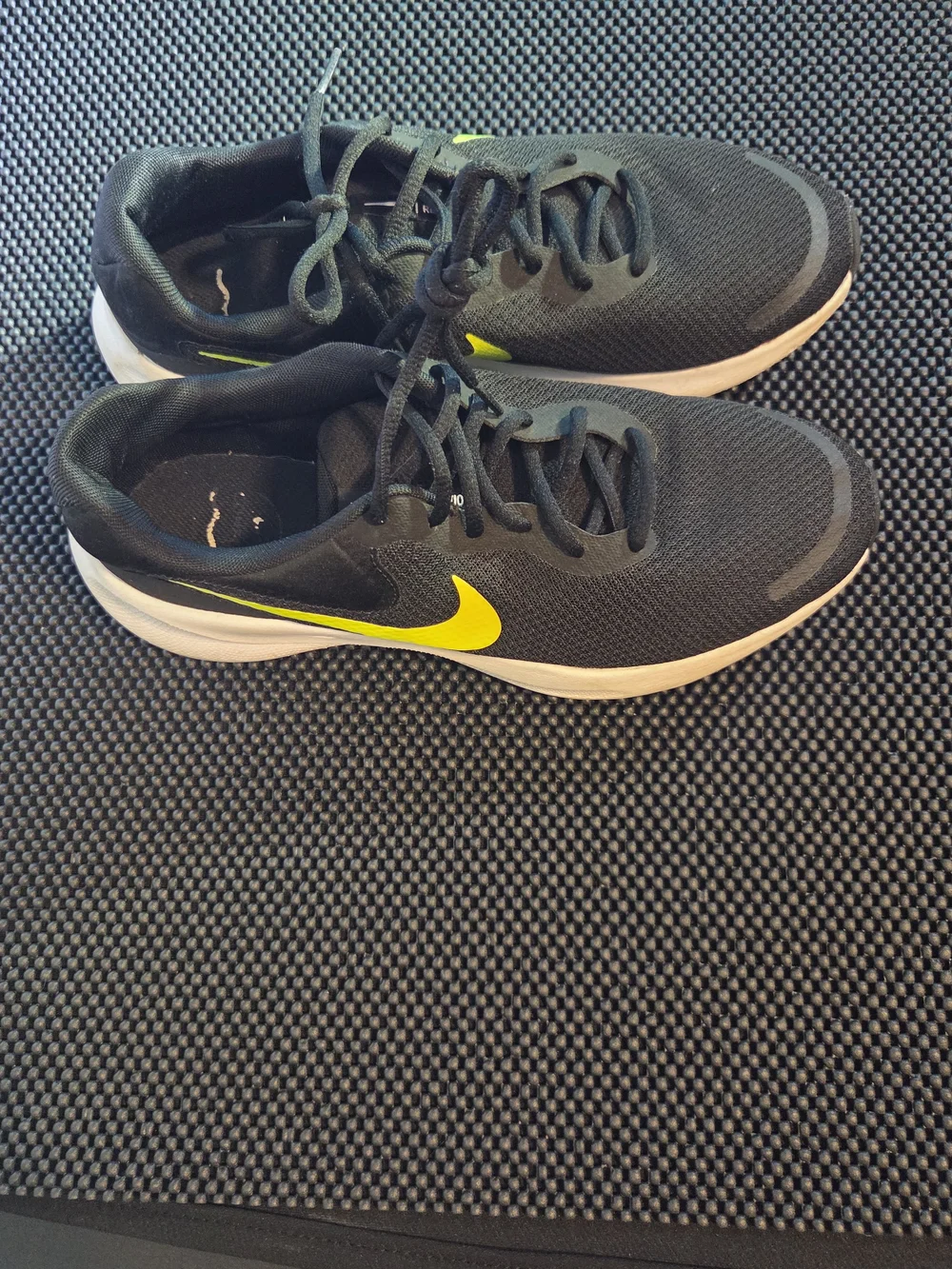 Nike Men's Black Running Shoes with Neon Yellow Swoosh